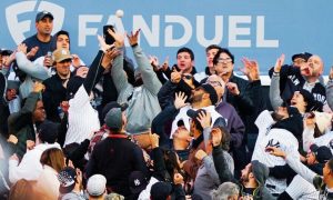 Baseball Fans Reach For Home Run Ball Hit By New York Yankees