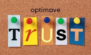 Colorful Trust Letters On Cork Board with Optimove logo