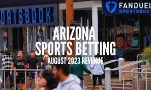 Fans Walk Past a FanDuel Sportsbook At Arizona's Footprint Center with Arizona sports betting August 2023 revenue