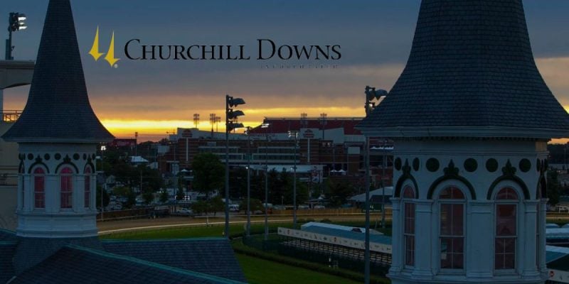 Sun Rises At Churchill Downs Horse Racing Track with company logo