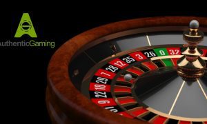 roulette wheel next to authentic gaming logo