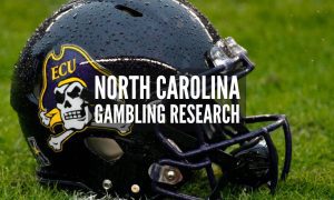East Carolina University Helmet Sits On Football Field with North Carolina gambling research