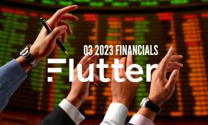 Stock Buyers Raise Hands On Exchange Market Floor with Flutter Entertainment logo and Q3 2023 financials