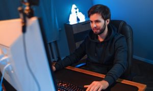 person seated at computer desk