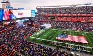 Gillette Stadium With Giant American Flag On Field