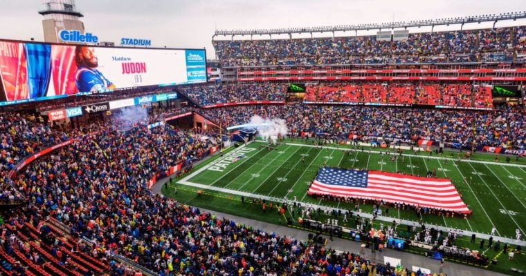 Gillette Stadium With Giant American Flag On Field
