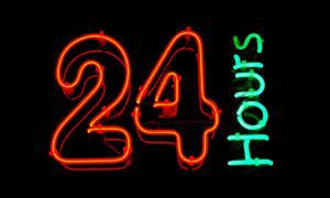 Glowing Neon Sign Reads 24 Hours