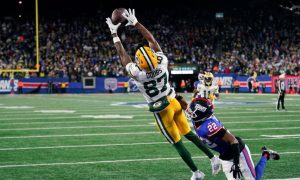 Green Bay Packers Wide Receiver Romeo Doubs Makes Catch during NFL football game