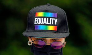 Protestor Wears LGBTQ+ Equality Hat