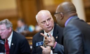 brandon beach listens to colleague