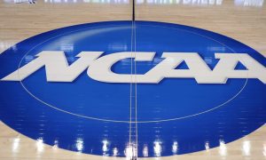 ncaa logo on basketball court