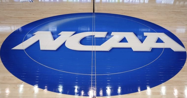 ncaa logo on basketball court