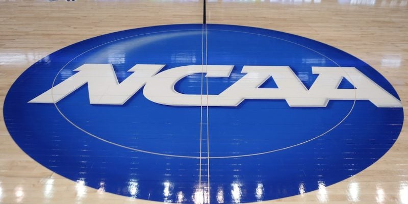 ncaa logo on basketball court