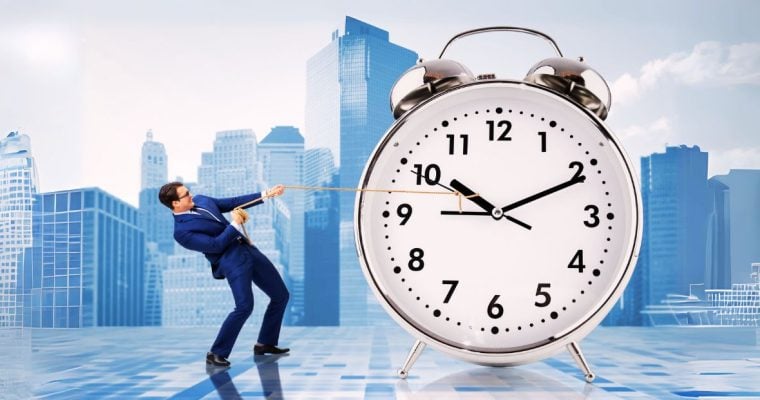 Business Man Holds Back Clock
