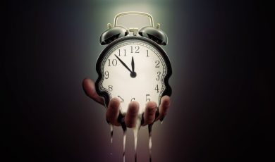 Hand Holding Melting Clock