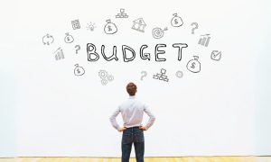Man Budget Wall Financial Concept