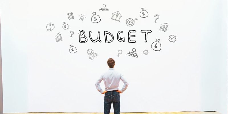 Man Budget Wall Financial Concept