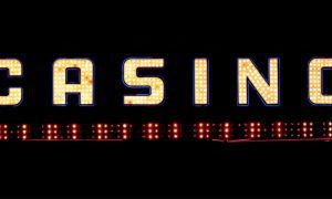 White Casino Marquee Sign With Red Lights