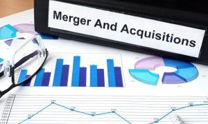 merger acquisition binder on paper
