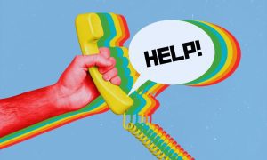 Hand Holds Phone Helpline Concept