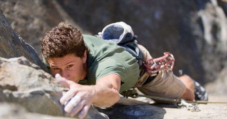 person climbing rock
