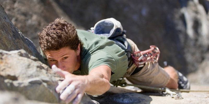 person climbing rock