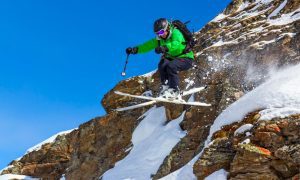person jumping on skis