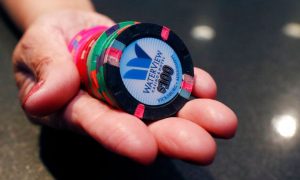 Cage Supervisor At WaterView Casino In Vicksburg, Mississippi holds a handful of sanitized chips