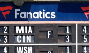 Fanatics Ad Over Out Of Town Baseball Scoreboard