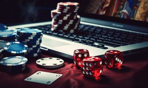 Laptop, Dice, Poker Chips, Online Casino Concept