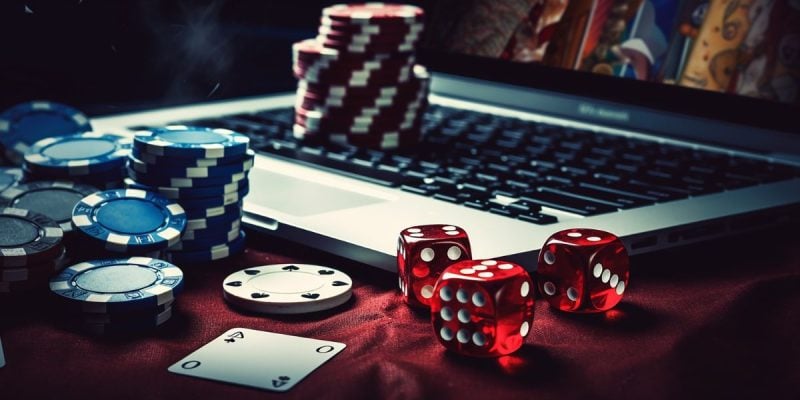 Laptop, Dice, Poker Chips, Online Casino Concept