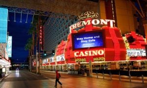 Man Walks By Fremont Casino In Las Vegas