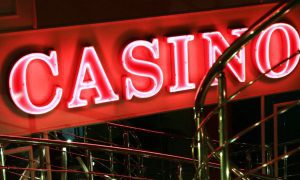 Pink Casino Neon Sign Shines