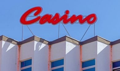 Red Casino Neon Sign Above Building