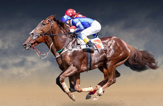 Two horses with jockeys in a tight race.