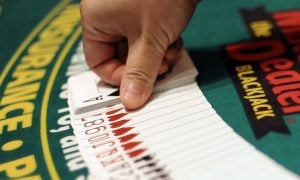 hand laying out playing cards