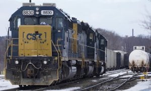 locomotive sitting on train tracks
