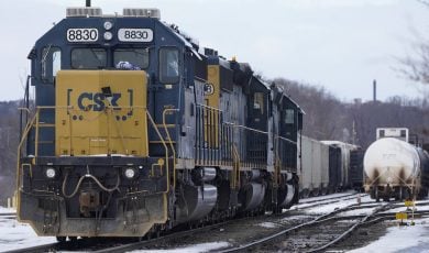 locomotive sitting on train tracks