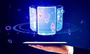 Hand Holds Tablet With Electronic Playing Cards