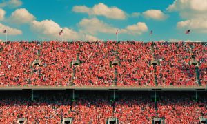 Thousands Of People In Orange At University Of Illinois for a Homecoming football game.