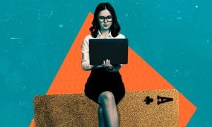 Woman With Laptop Sits On Playing Card