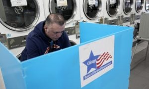 person voting in laundromat