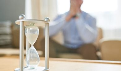 sands falling through hourglass
