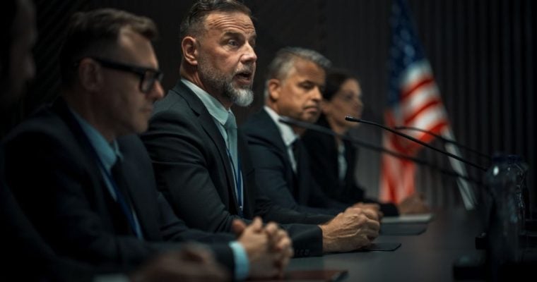 Committee Men In Meeting With American Flag