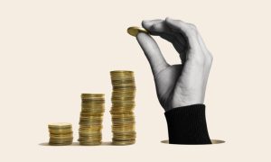 Hand With Gold Stacked Coins