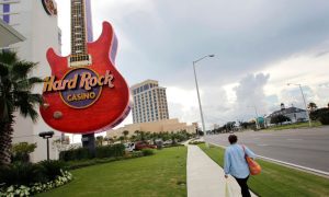 Pedestrian Walking Past Hard Rock Casino In Biloxi, Miss