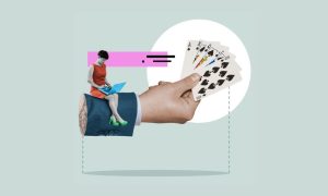 Woman On Laptop On Hand Holding Playing Cards