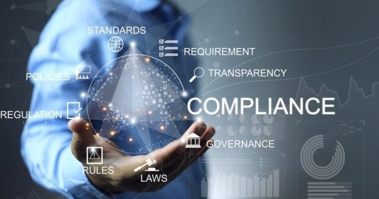 Business Man Holds Hand Out With Digital Sphere Compliance Concept