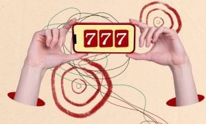 Hands Hold Cell Phone Displaying 3 Red 7's Slots Game