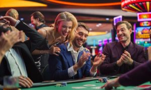 Happy People Gambling At Casino Table